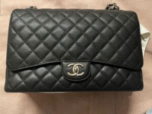Bolsa Chanel Double Flap Caviar Maxi Preta